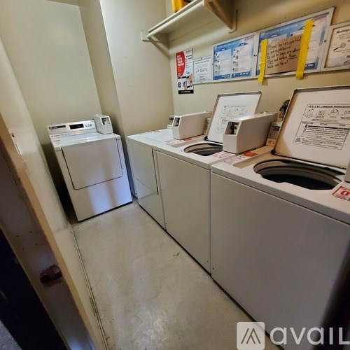A row of washing machines in a laundromat.