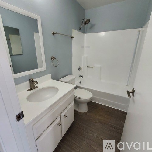 A bathroom with a white toilet and sink.