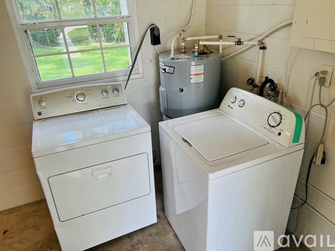 A washing machine and dryer in a laundry room.