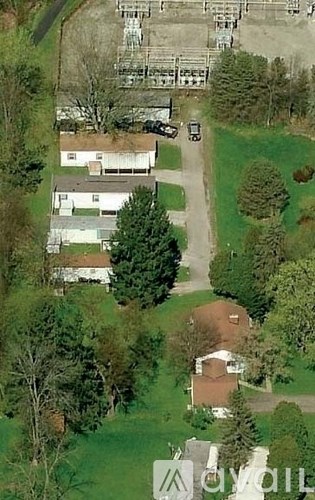 A bird's eye view of a residential area with houses and trees.