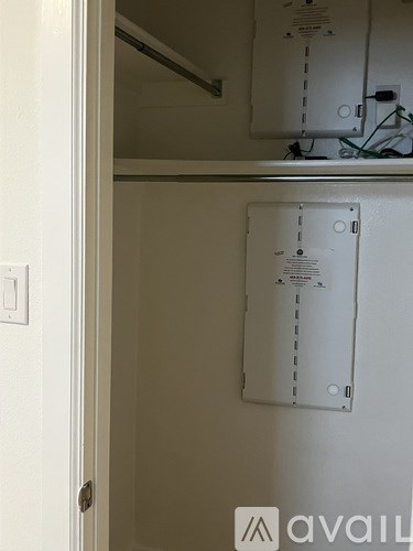 A white door with a white wall behind it.