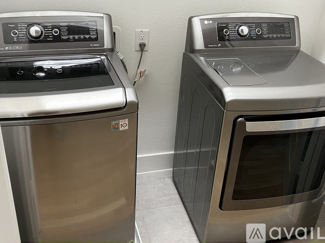 Two front load washing machines are side by side.