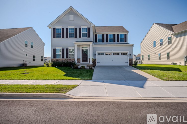 A house with a garage is available for sale.