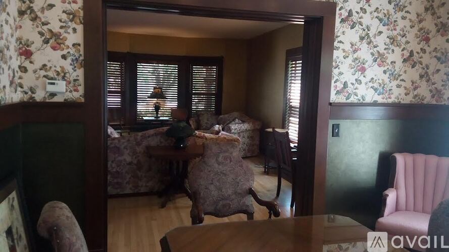 A living room with a couch, chair, and table.