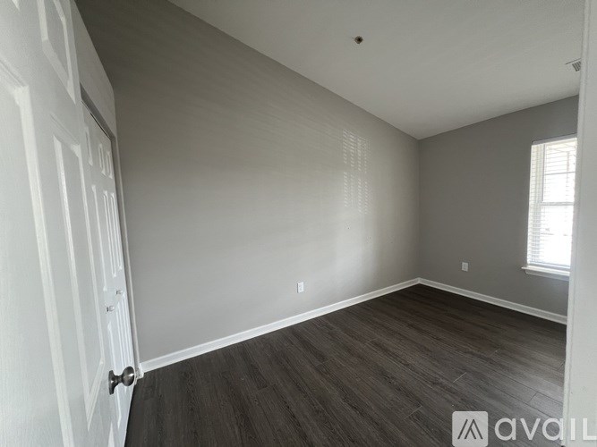 A room with a door and a window.