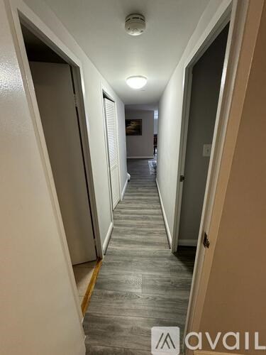 A long hallway with doors on both sides.