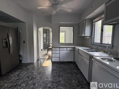 A kitchen with granite countertops and stainless steel appliances.