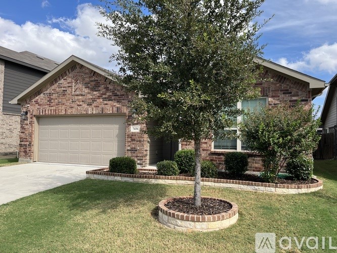 A house with a tree in front of it.