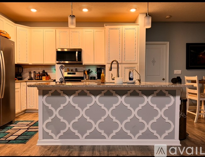 A kitchen with a patterned island in the middle.