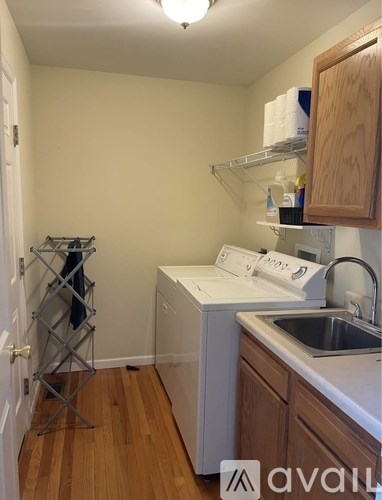 A small kitchen with a washing machine and dryer.