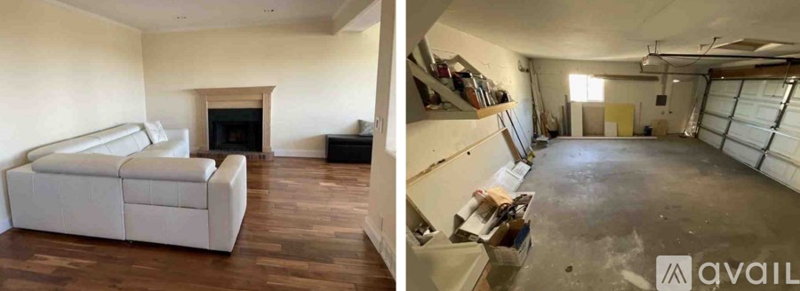 A living room with a fireplace and a white couch.