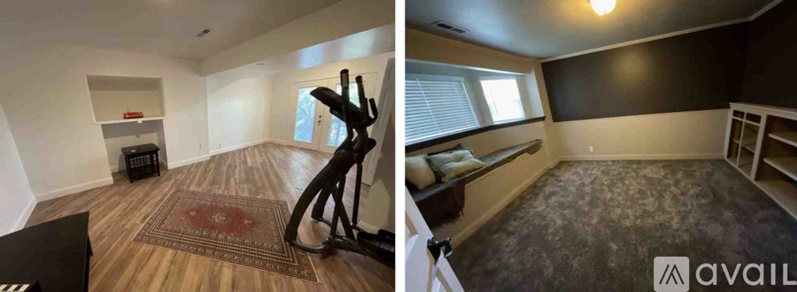 A room with a rug and a black speaker on the floor.