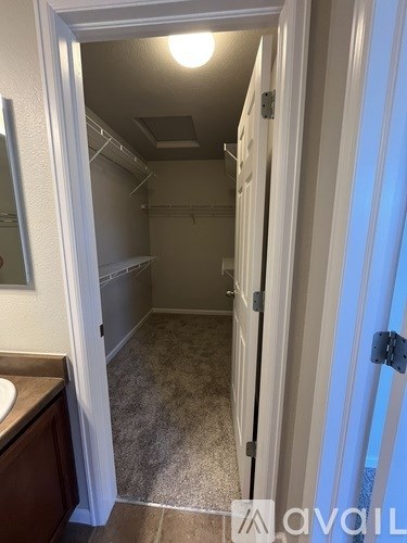 A small, empty room with a sink and a door.