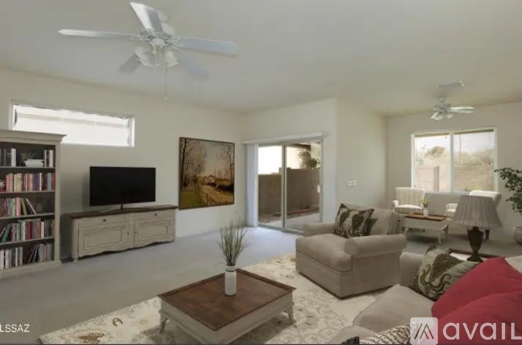 A living room with a television, couches, and a coffee table.