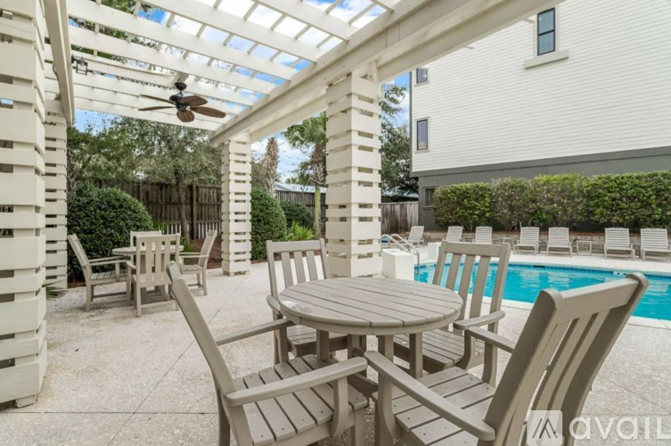 A patio with a table and chairs is available for rent.