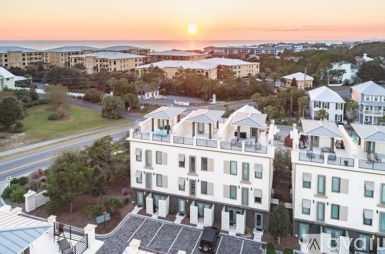 A sunset view of a residential area with multiple buildings.