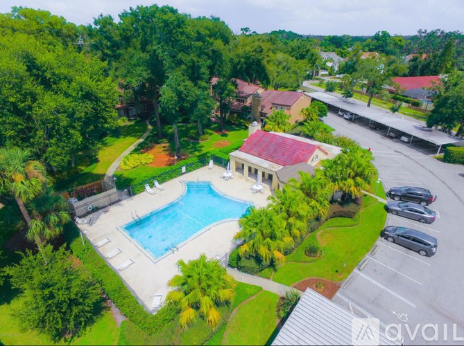 A large house with a pool in the backyard.