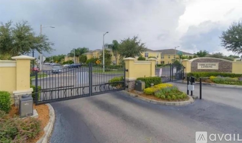 A gated entrance to a property with a sign that reads "Cedar Lodge".