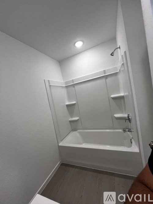 A white bathroom with a walk-in shower.