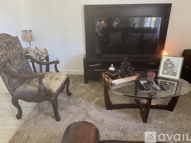 A clothing store with a variety of shirts and tops on display.