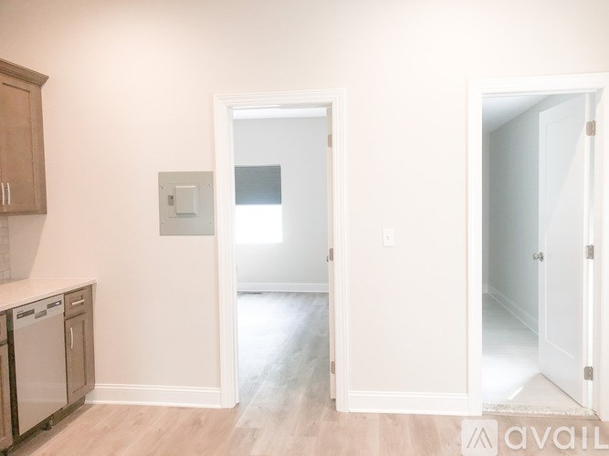 A kitchen with a washer and dryer in it.