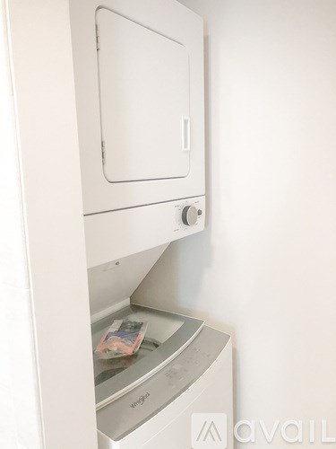 A white oven with a control knob on the front.