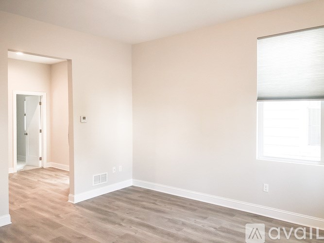 A room with a window and a door.