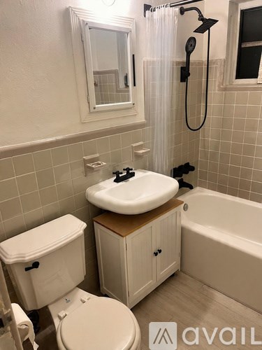 A black door with a red bow on it.