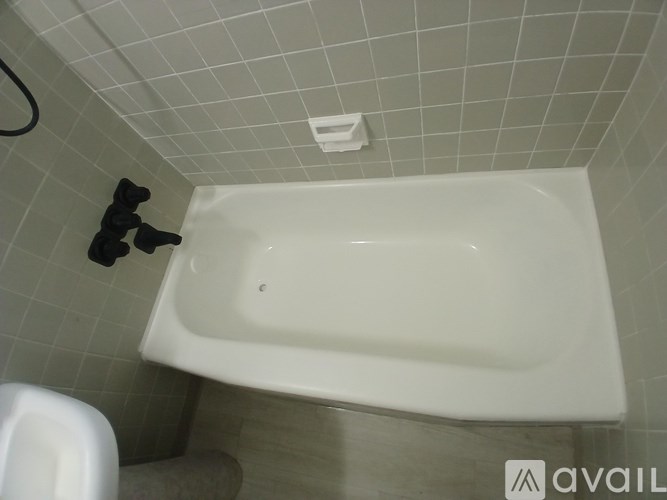 A framed artwork with squares in shades of grey and gold.