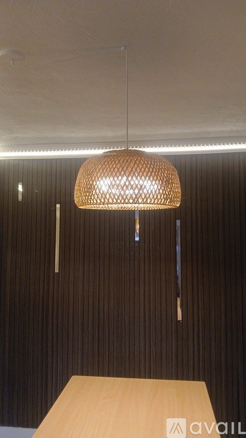 A white ceiling with a vent and lights.