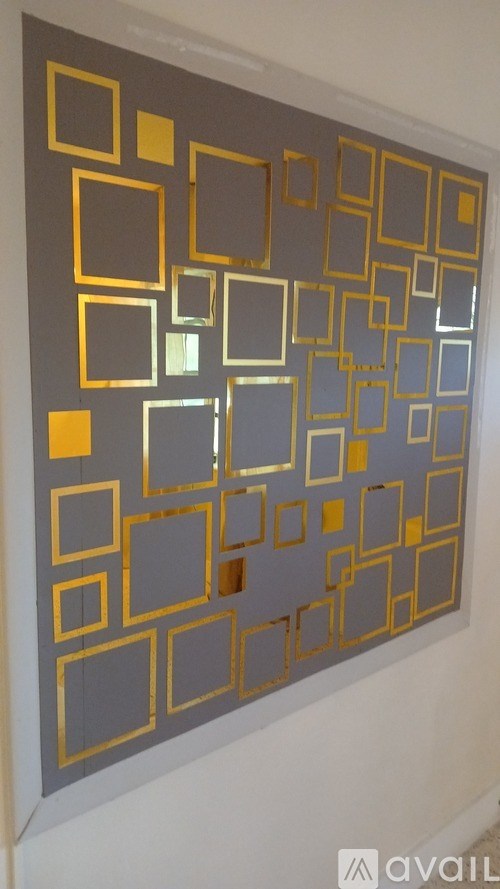 A wall with a large number of squares on it.