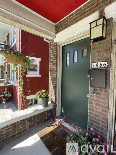 A green door with the number 1966 on it.