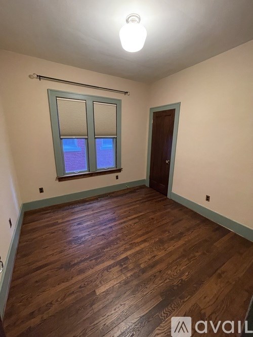 A floor plan of an apartment with a kitchen, living room, and two bedrooms.