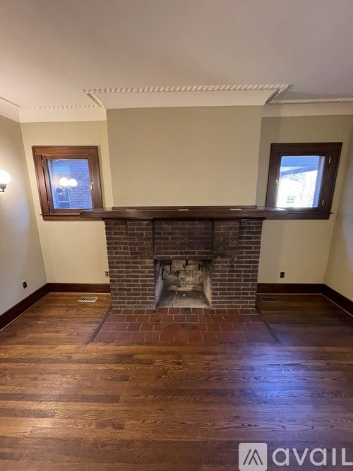 A bathroom with a white sink and a mirror above it.