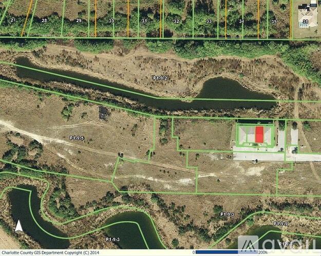 A map shows a green area with a red rectangle in the middle and a white arrow pointing to a path.