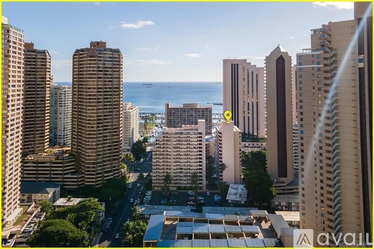 A cityscape with a yellow marker on one of the buildings.