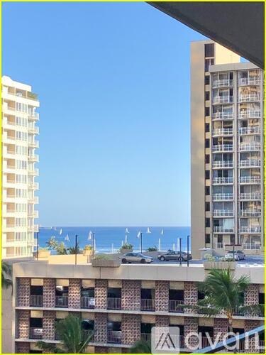 A view of a beach from a high rise building.