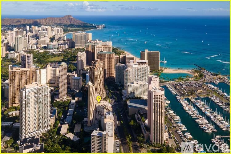 A cityscape with a yellow pin marking a specific location.