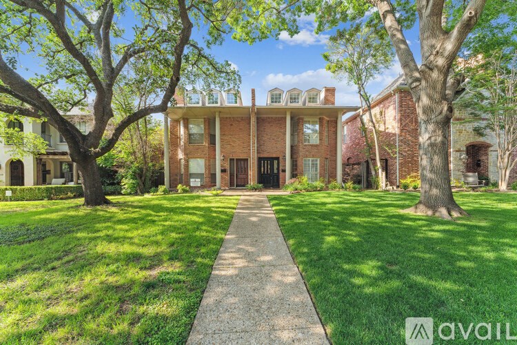 A brick building with a walkway in front of it.