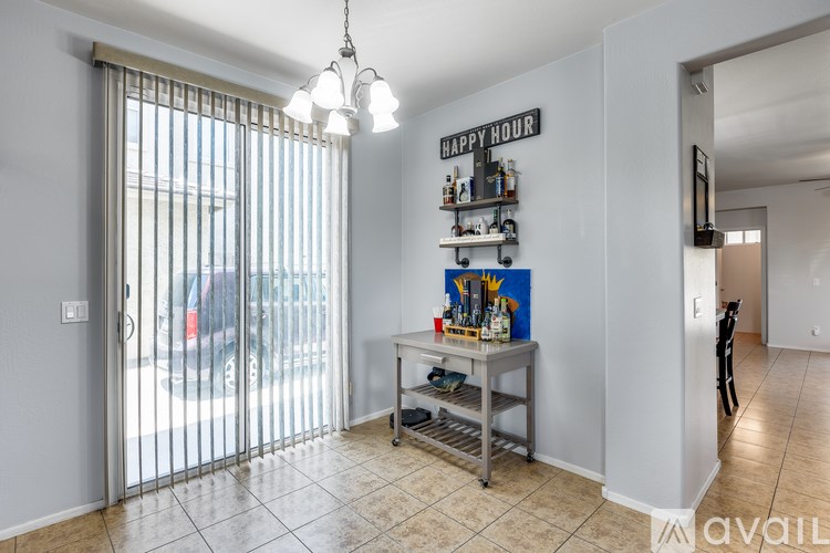 A room with a bar area and a sign that says Happy Hour.