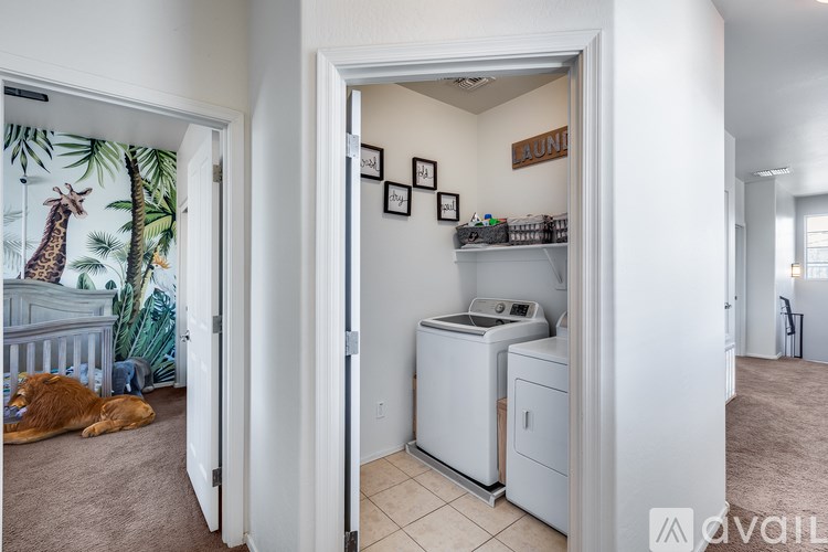 A room with a washer and dryer in it.