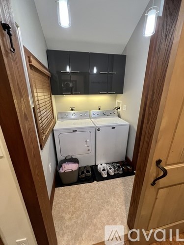 A small kitchen with a white fridge and a white dishwasher.