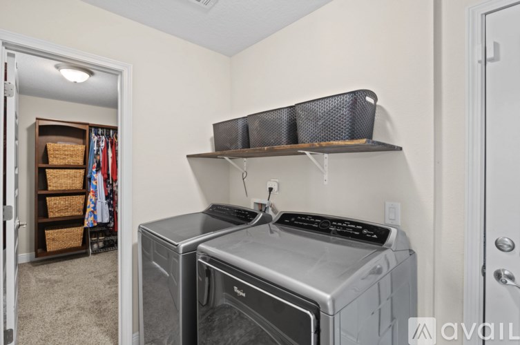 A laundry room with a washer and dryer.