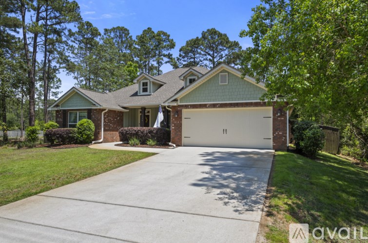 A house with a driveway in front of it.
