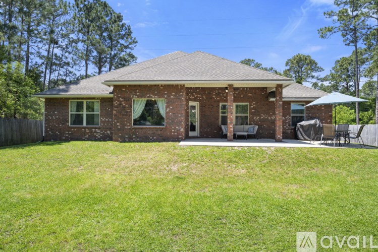 A house with a lawn in front of it.