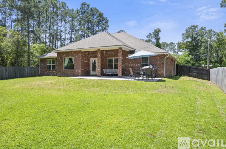 A house with a lawn in front of it.