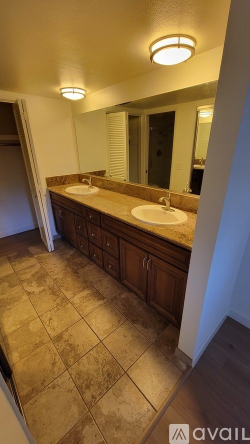 A bathroom with a sink and a mirror.