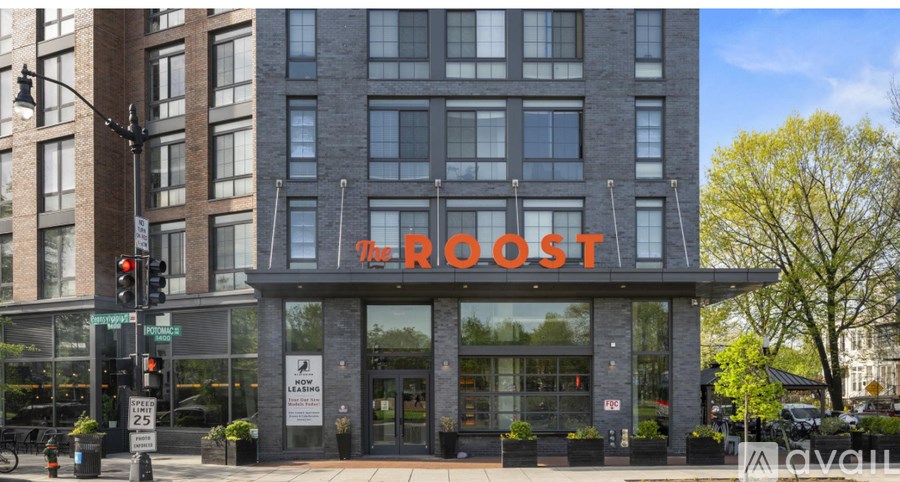 The front of a building with a large sign that says "The Roost".