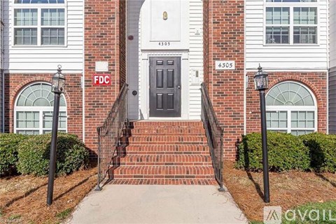 A building with a black door and a sign that says FDC.