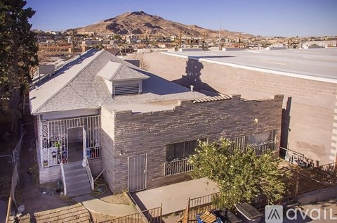A house with a mountain in the background is for sale.